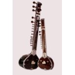 MODERN INDIAN SITAR, RETAILED BY BINA MUSICAL STORES, 49 ½? (126cm) long, together with a SMALLER,