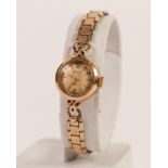 ACCURIST LADY'S 9ct GOLD WRISTWATCH with 21 jewelled movement small circular silvered dial, rolled