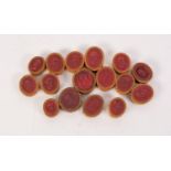COLLECTION OF SIXTEEN RED WAX OVAL CAMEOS, with paper surround, 1? x ¾? (2.5cm x 2cm) and smaller,