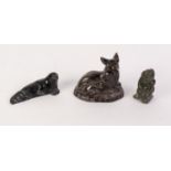 INUIT CARVED GREEN HARD STONE FIGURE OF A SEATED MAN WITH DOG, together with ANOTHER OF A SEAL, both