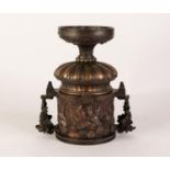 CAST AND BRONZE PATINATED METAL TWO HANDLED PEDESTAL URN, embossed autour with bacchanalian scenes
