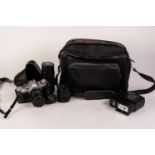 CANON AV1 SLR CAMERA with FD 50 mm 1:18 lens in original black leather case with instructions.