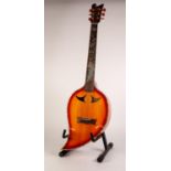 MODERN SIX STRING SCROLL TOP TYPE MANDOLIN, with sunburst comma shaped body, the back inlaid in
