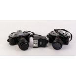 TWO MINOLTA X-300 SLR ROLL FILM CAMERAS FITTED WITH SIRIUS 28-70mm, f3.5-4.5, AUTO ZOOM LENSES,