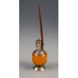 ORIENTAL AMBER AND WHITE METAL MOUNTED PEDESTAL VASE SHAPED SCENT BOTTLE, amber drum shaped body
