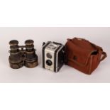 PAIR BLACK LACQUERED BRASS AND LEATHER CLAD VINTAGE BINOCULARS with extending lens hood together