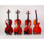 FOUR STUDENT 3/4 SIZE VIOLINS in cases with a total of three bows (4)