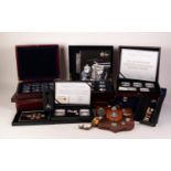 NINE CASED SETS MODERN ROYAL MINT, WESTMINSTER AND OTHER CUPRO NICKEL COINS, Police badges on wooden