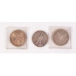 THREE AMERICAN SILVER DOLLARS, viz 1879 (VF), 1884 (F) and 1922, showing a little wear (3)