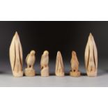 PAIR PROBABLY 1930's CARVED WHALES TOOTH FIGURES OF EMPEROR PENGUINS with incised detail