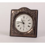 R. CARR MODERN SILVER FRONTED MANTEL CLOCK with embossed design of ribbon swags, on blue plush