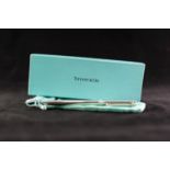 LATE 20th CENTURY TIFFANY & CO SILVER CASED BALL POINT PEN with elongated "T" shape clip, stamped