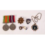 TWO WORLD WAR II SERVICE MEDALS WITH RIBBONS, viz 1939 - 45 war medal and defence medal with