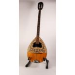 MODERN EIGHT STRING BOUZOUKI, with leafy scroll work to the body, 38 ¾? (98.4cm) long