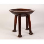 TRIBAL WOODEN FOUR LEGGED DISH TOPPED STOOL