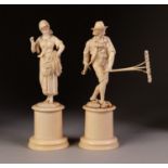 PAIR OF 19th CENTURY DIEPPE CARVED IVORY PEASANT FIELD WORKER FIGURES he with a hay fork , she