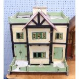 INTER WAR YEARS PAINTED WOODEN DOLLS HOUSE WITH METAL LATTICED WINDOWS projecting central bay with