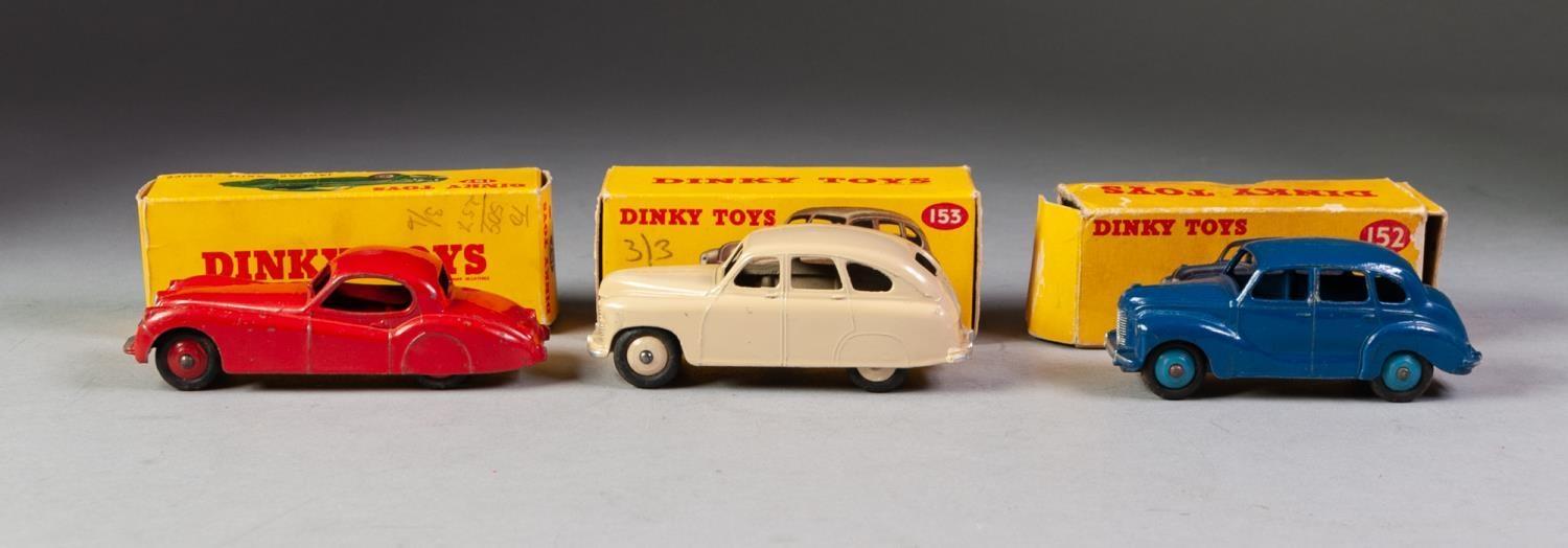 THREE BOXED DINKY TOYS No 152 Austin Devon saloon ble with medium blue spun hubs, box has loose