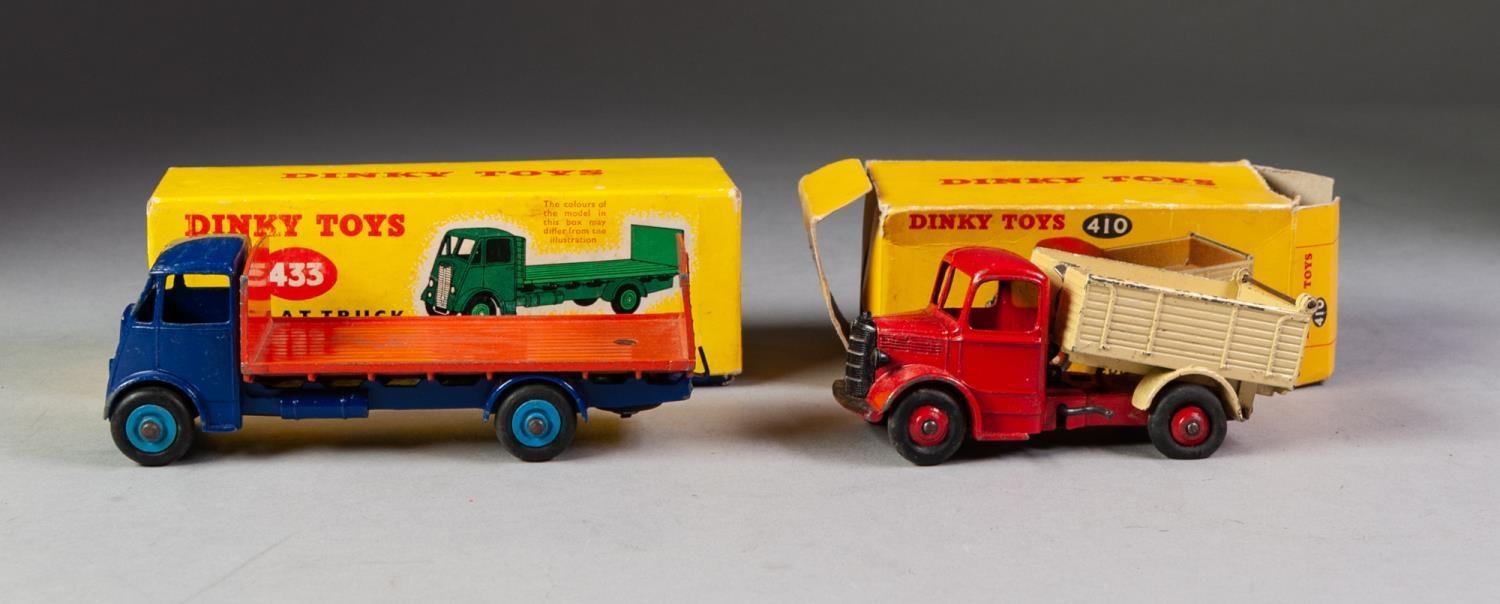 TWO BOXED DINKY COMMERCIAL TOYS No 410 Bedford end tipper , red cab, cream back, red hubs in