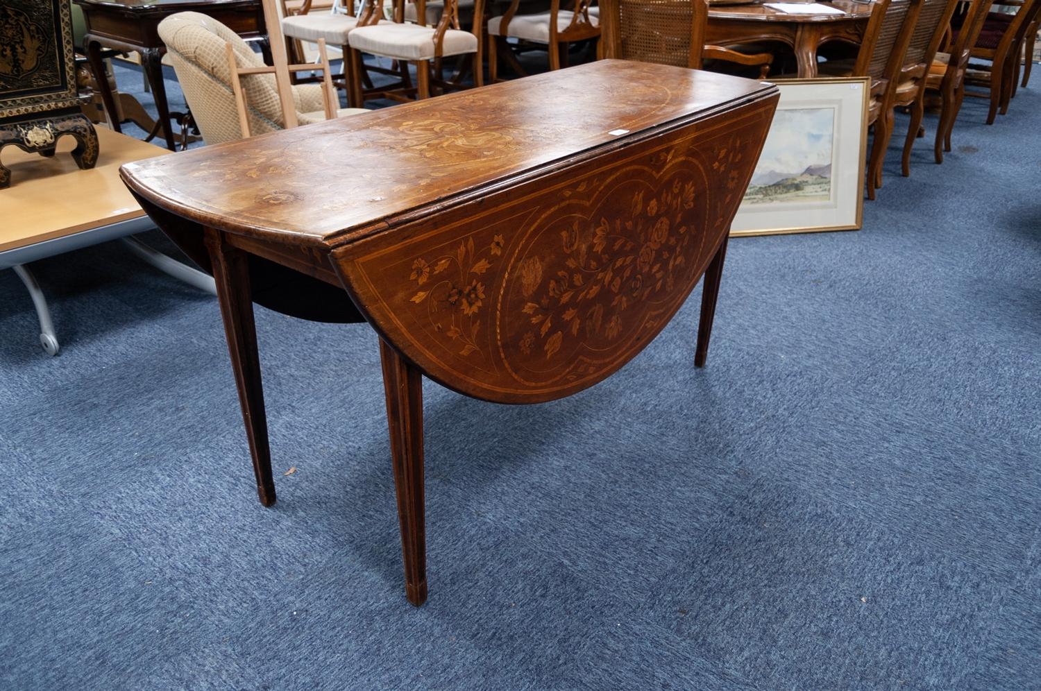 A NINETEENTH CENTURY DUTCH MAHOGANY FLORAL MARQUETRY INLAID CIRCULAR DROP FLAP DINING TABLE, on