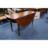 A NINETEENTH CENTURY DUTCH MAHOGANY FLORAL MARQUETRY INLAID CIRCULAR DROP FLAP DINING TABLE, on