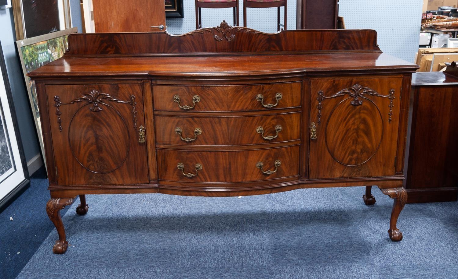 EDWARDIAN BOW FRONTED FIGURED MAHOGANY SIDEBOARD, the shaped oblong top with bow fronted centre