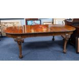 EDWARDIAN WALNUT WIND-OUT EXTENDING DINING TABLE WITH TWO ADDITIONAL LEAVES, the rounded oblong