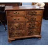 GEORGIAN FIGURED MAHOGANY CHEST OF DRAWERS OF SMALL PROPORTIONS, the moulded oblong top above two