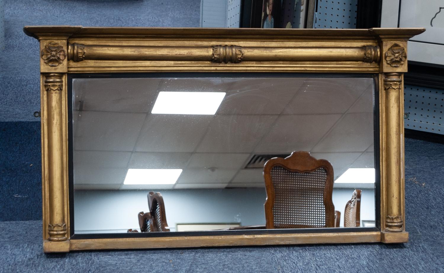 EARLY NINETEENTH CENTURY GILT WOOD AND GESSO OVERMANTLE MIRROR, the oblong plate with reeded,