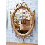 EARLY TWENTIETH CENTURY GEORGIAN STYLE GILT WOOD AND GESSO WALL MIRROR, the oval, bevel edged