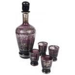 A Bohemian purple and silvered glass liqueur decanter with four matching shot glasses