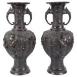 A pair of large decorative twin handled Japanese bronze vases