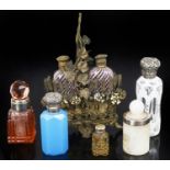 An assorted collection of seven glass perfume bottles,