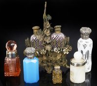 An assorted collection of seven glass perfume bottles,