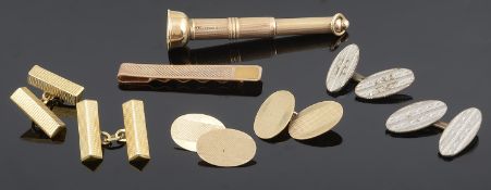 A gold pendant cigar piercer together with gold cufflinks and tie slide
