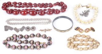 A long string of Art Deco cherry amber beads together with other items