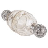 A silver topped clear glass double ended perfume bottle
