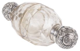 A silver topped clear glass double ended perfume bottle