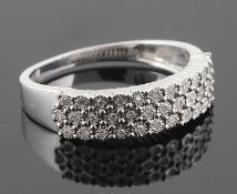 A contemporary diamond set white gold mounted dress ring