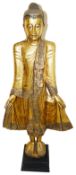 A large vintage decorative wooden figure of a Buddha