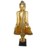 A large vintage decorative wooden figure of a Buddha