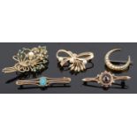 A Victorian seed pearl set horseshoe brooch and four others,