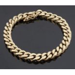 A contemporary yellow metal curb link bracelet