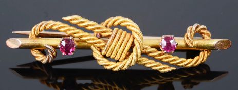 A Victorian 15ct gold ruby set rope twist bar brooch