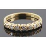 A delicate diamond set half eternity ring together with a sapphire and diamond set cluster ring
