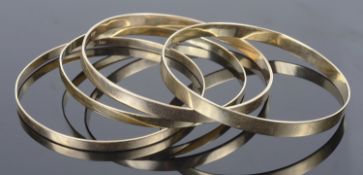 Four 9ct stiff bracelets