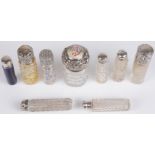 A collection of Victorian glass and silver topped cylindrical bottles