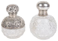 An Edwardian silver and cut glass globular perfume bottle and another