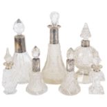 A small collection of Victorian and later glass and silver collared perfume bottles
