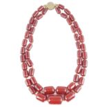 An Art Deco large cherry amber bead double row necklace